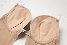 Formivelle backless body shaper bra in nude with adjustable clear straps on white surface