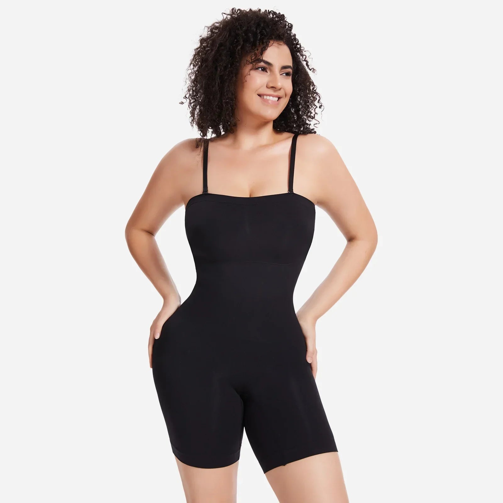 Woman wearing black Formivelle convertible strapless sculpting bodysuit on white background