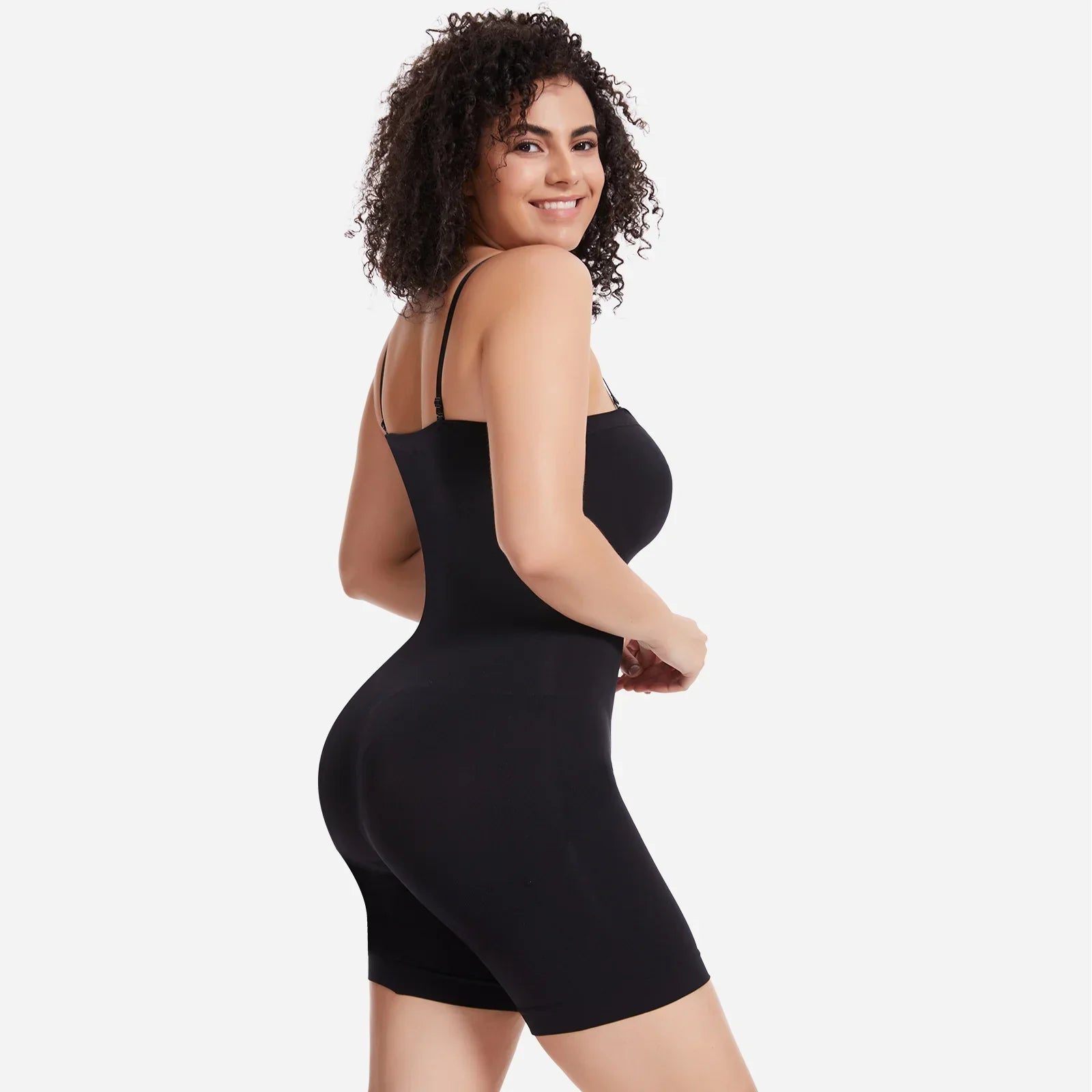Smiling woman wearing a black Formivelle sculpting bodysuit with convertible straps.