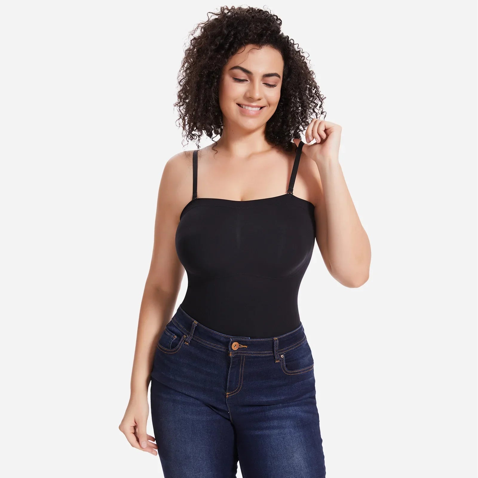 Smiling woman modeling Formivelle black convertible strapless sculpting bodysuit and jeans