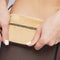 Close-up of hands showing Formivelle fleece-lined tights with soft beige interior