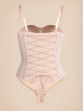 Nude Formivelle push-up corset bodysuit with lace-up front and adjustable straps on neutral background