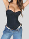Woman modeling Formivelle black push-up corset bodysuit with blue jeans, shapewear focus